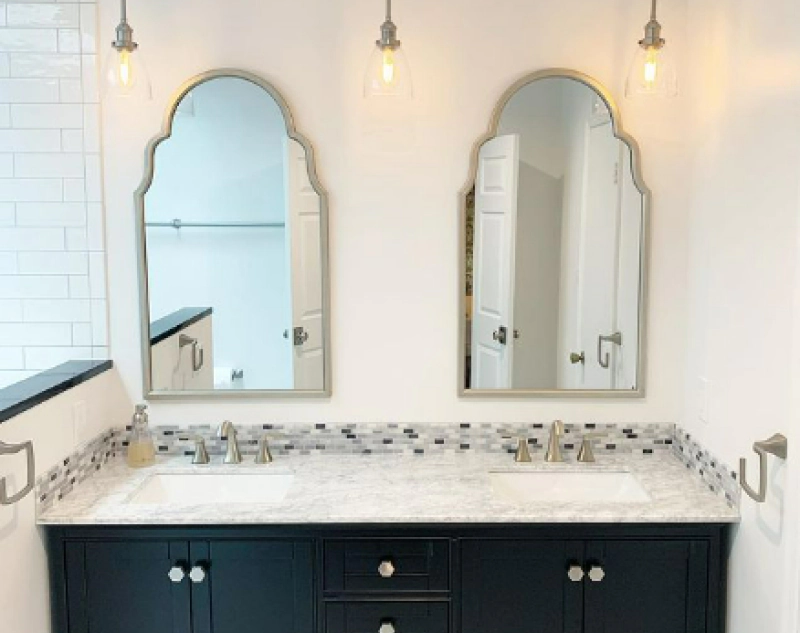 two mirrors and cabinets in shower