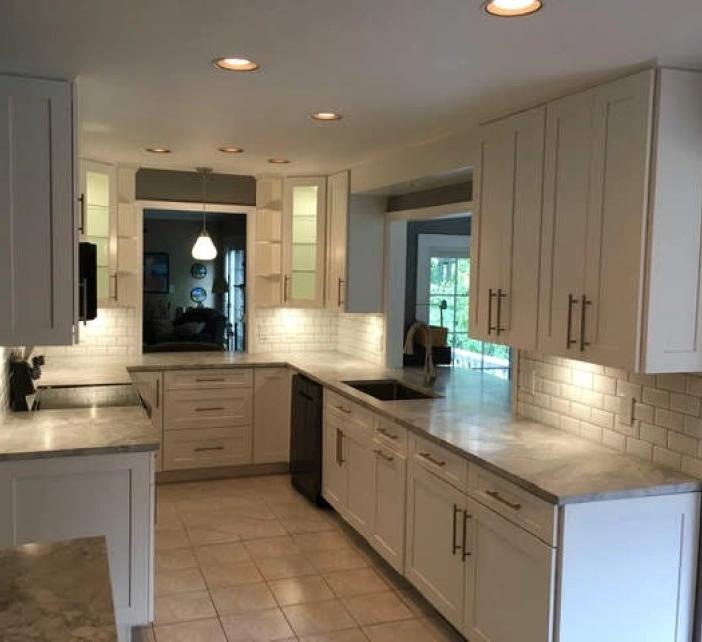 white beige tiles kitchen with white cabinets